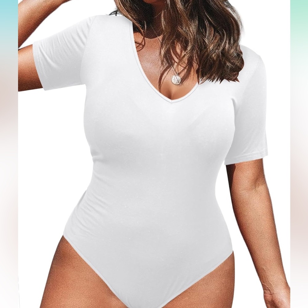 Never worn body suit in white